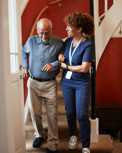 Caregiver attending to a Resident at Trustwell Living at Clyde Gardens Place in Clyde, Ohio