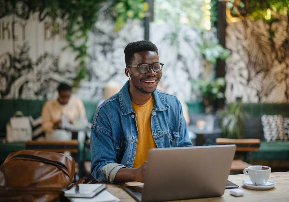A man using a laptop at Main Street Vista in Holly Springs, North Carolina 