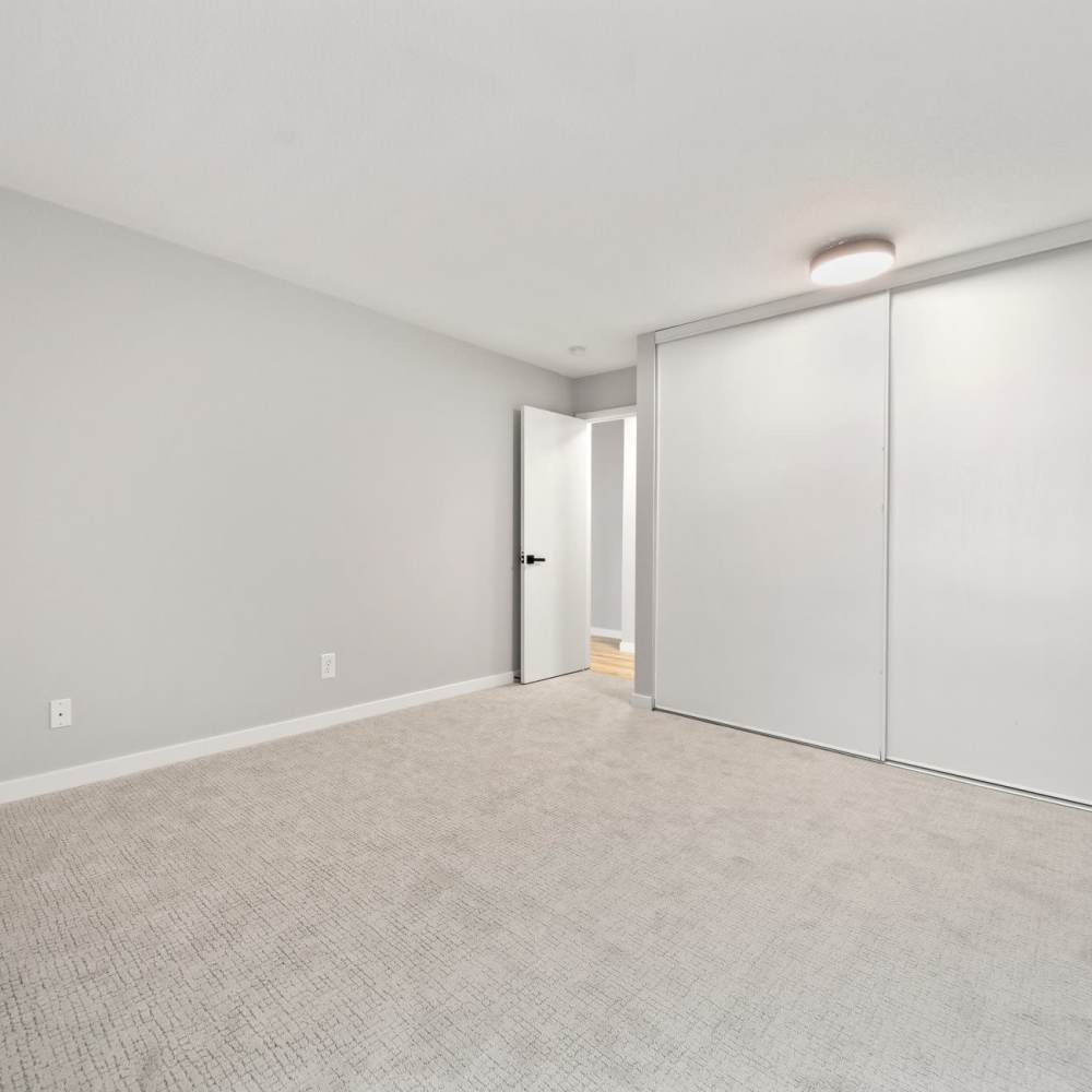 Living room with large closets at Morada in Crystal, Minnesota