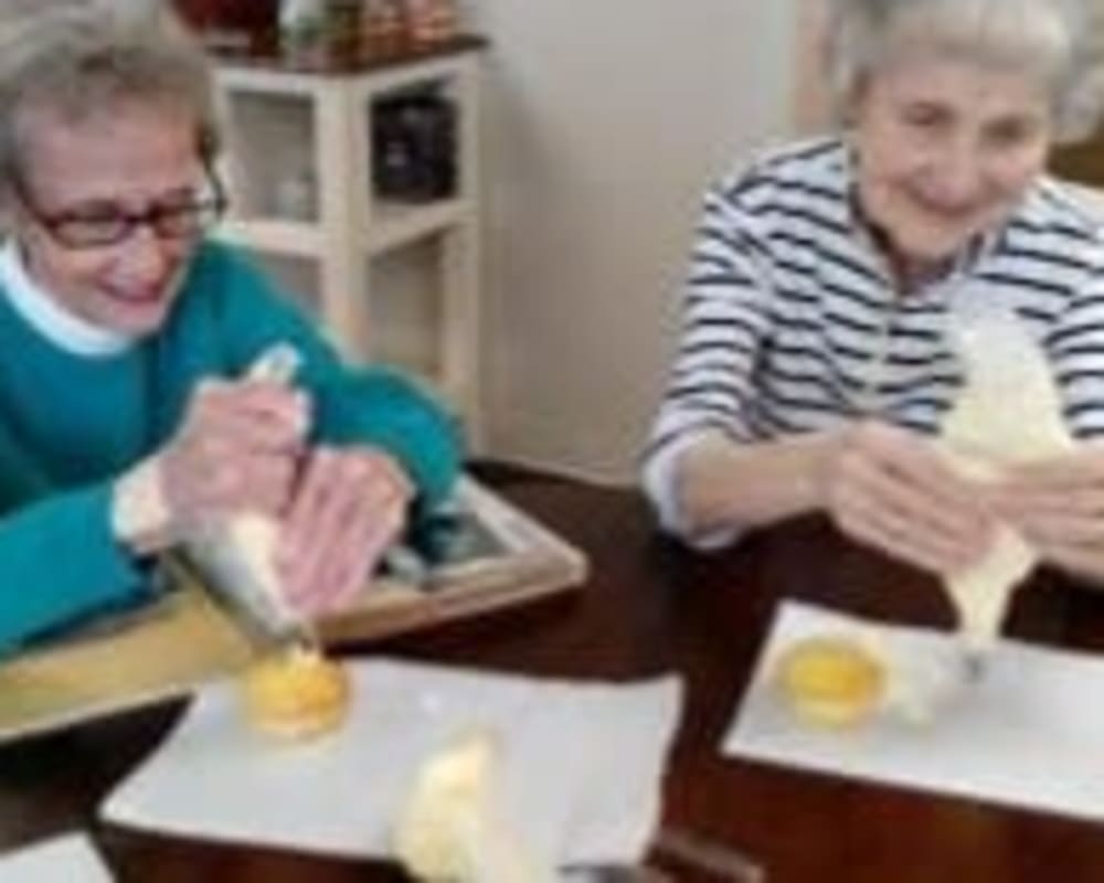 Resident Tura decorating cakes for her dare to dream event from Milestone Senior Living Stoughton in Stoughton, Wisconsin.