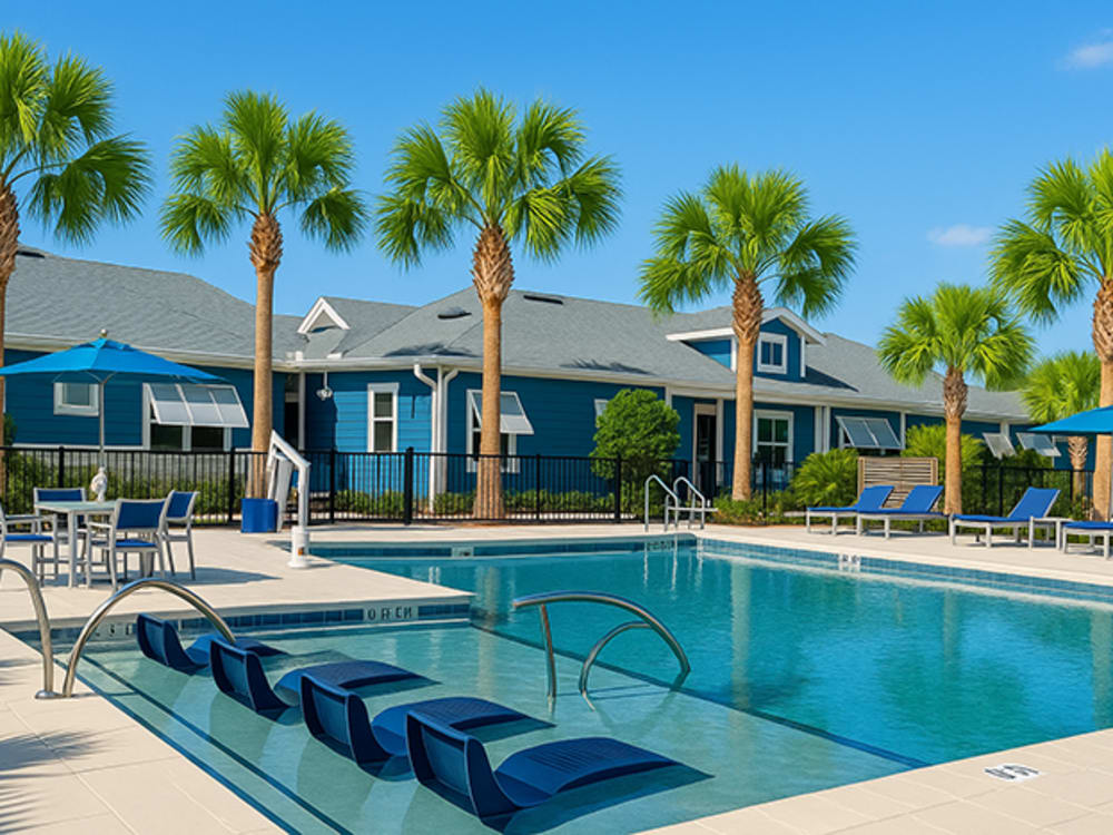 Resort-style swimming pool with sundeck at Viva At Palm Coast in Palm Coast, Florida