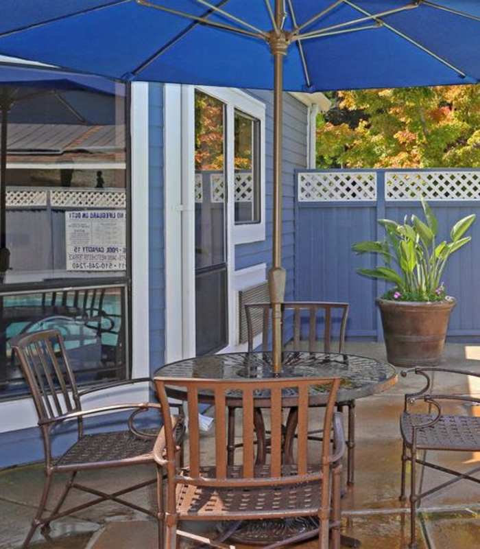 Sauna beside the pool and outdoor seating area at Amber Court in Fremont, California