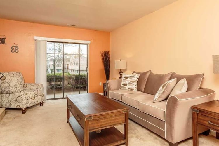 Enjoy family time in your living room at Meadowbrook Apartments in Slingerlands, NY