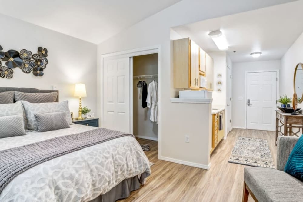 Serene bedroom in apartment at Woodside Senior Living in Springfield, Oregon. 