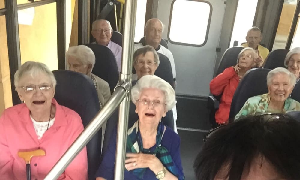 Group of residents on a trip on the community bus at Wesley Haven Villa in Pensacola, Florida. 