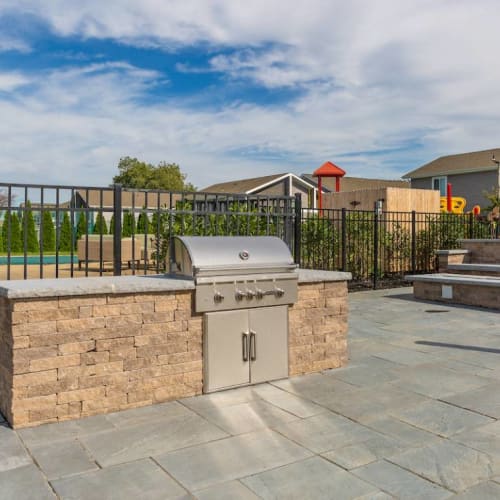 Grilling station by the pool at Addison at Princeton Meadows in Plainsboro Township, New Jersey
