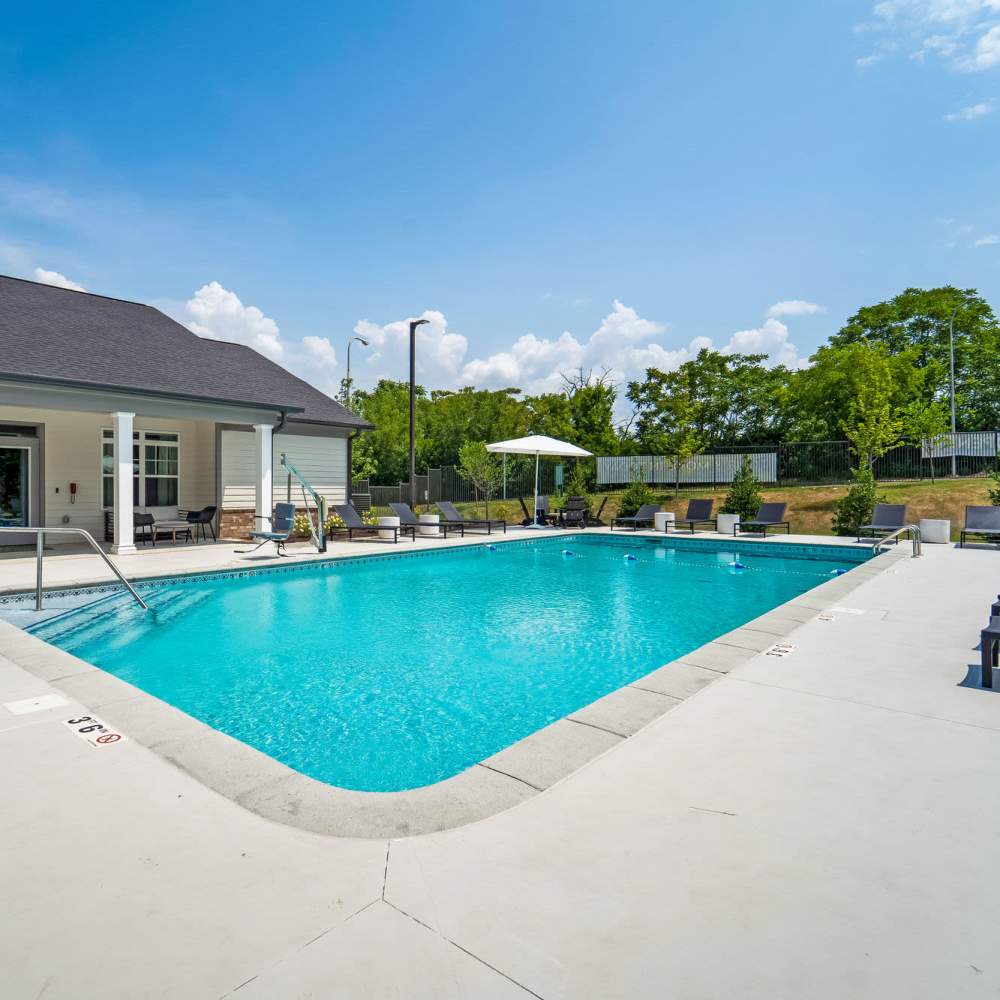 Swimming pool with lounge seating at The Warrick in Nashville, Tennessee