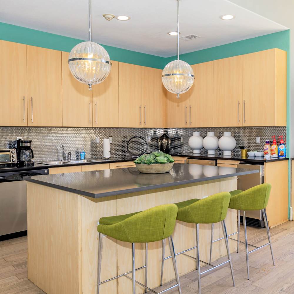 Clubhouse kitchen with bar stool at One Belmar Place in Lakewood, Colorado