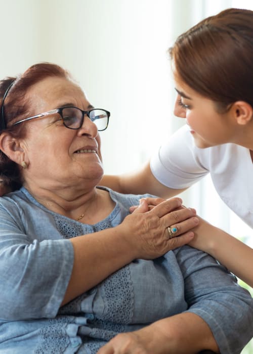 One of our caring staff taking care of the resident at Grand Villa of Englewood in Englewood, Florida