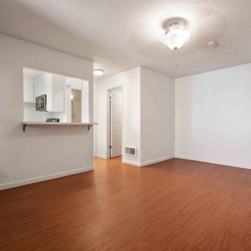 Spacious living area in an apartment at Village of Taxco in San Jose, California