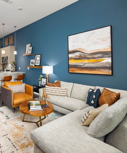 Living room with soft, plush tan carpeting at The Edison Sugarloaf in Lawrenceville, Georgia