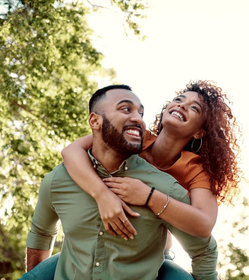 Residents smiling on a walk through a park near James River Pointe in Richmond, Virginia