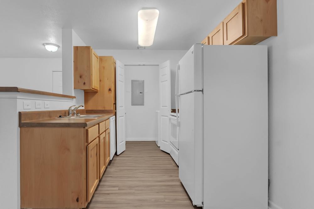Upgraded kitchen with modern cabinetry and stainless appliances at Wickham Gardens in Sapulpa, Oklahoma