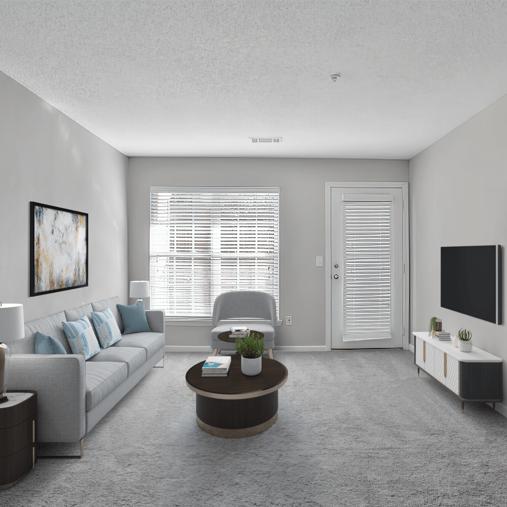 Hardwood-style flooring and balcony access from the living room at Crestmont in Columbia, South Carolina