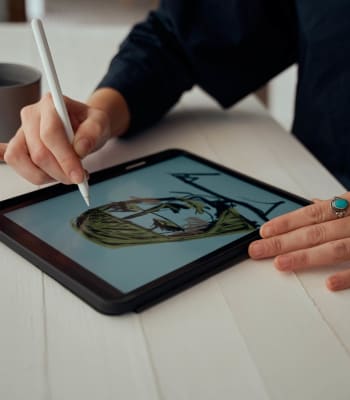 A resident sketches at University Lofts at Russellville, Russellville, Arkansas