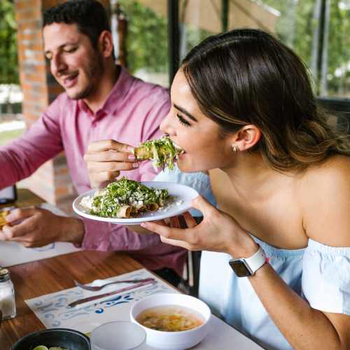 Couple having food near Kearney Meadows Apartments in Waunakee, Wisconsin