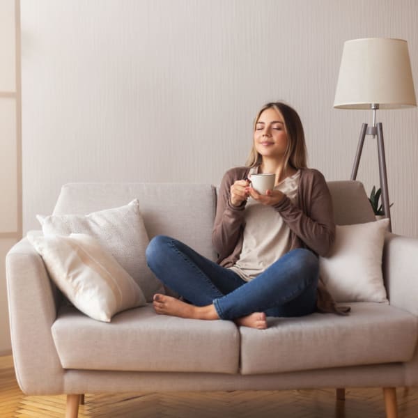 A resident enjoys a morning cup of coffee at Mason Avenue, Alexandria, Virginia