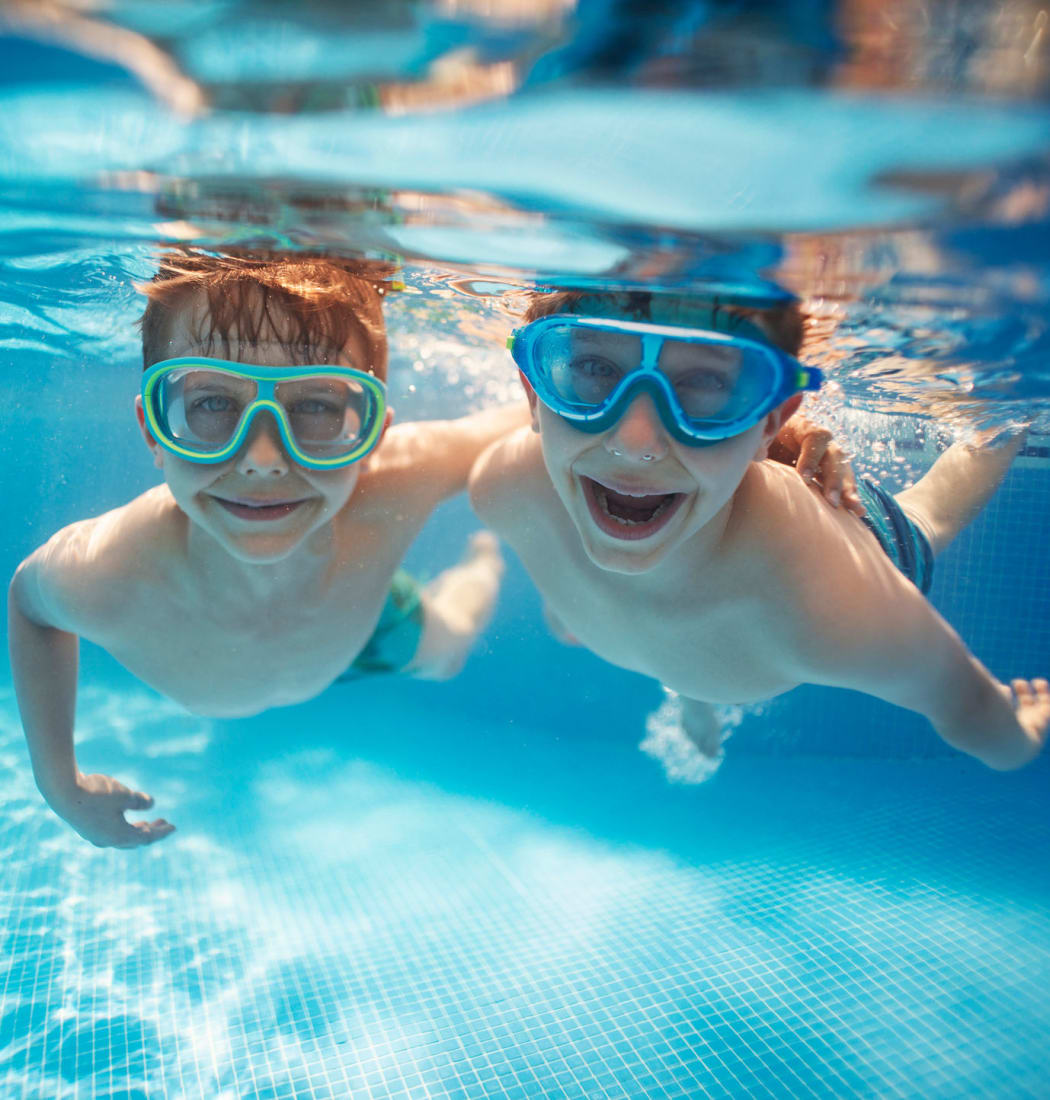 Kids swimming in the pool at IMT Park Encino in Encino, California