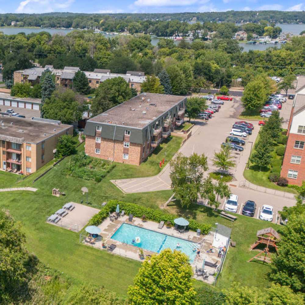 Community aerial view with swimming pool and parking at Solace on Lake Minnetonka in Spring Park, Minnesota