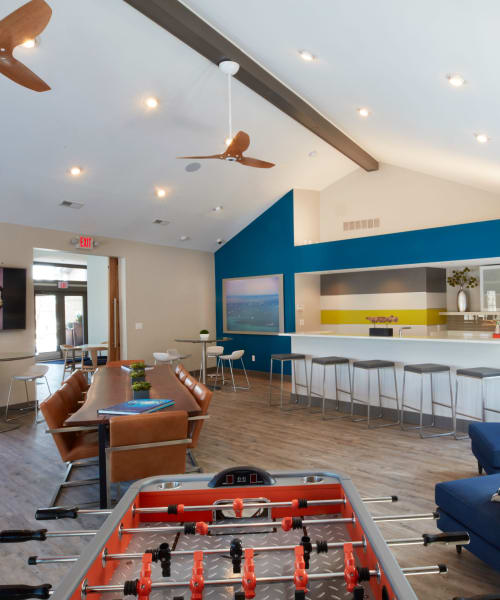 Resident lounge with games and a coffee bar at Lakeside Terraces in Sterling Heights, Michigan