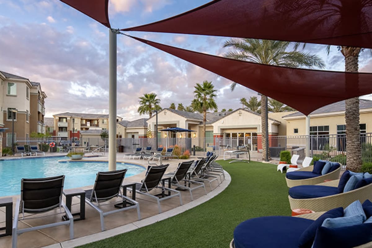 Pool with lounge chairs and shade areas at Tamarron, Phoenix, Arizona