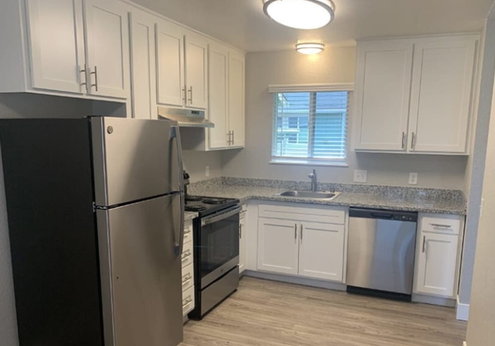 Kitchen with Kitchen with stainless-steel appliances at Alderwood in Ukiah, California at Alderwood in Ukiah, California