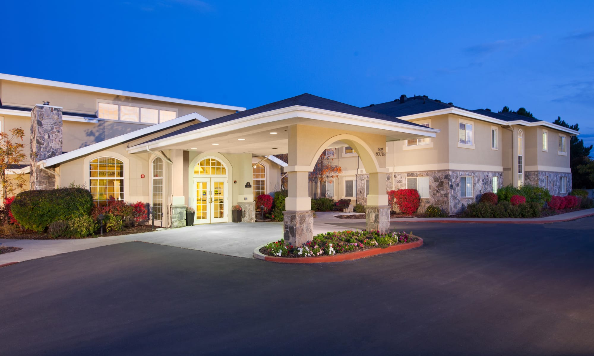 Front of Building at night at Chancellor Gardens at Clearfield in Clearfield, Utah