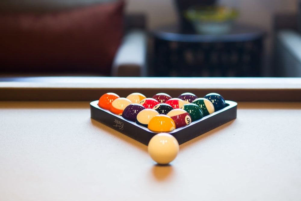 Woman playing pool in Bradenton, Florida near Goldelm at Bennett Park