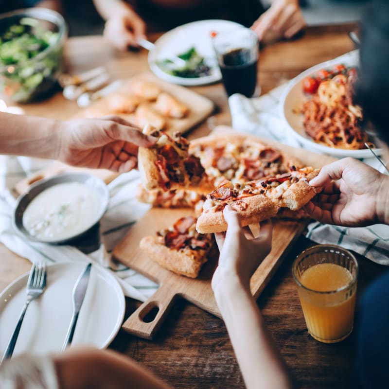 Residents enjoy pizza near CovePointe at The Landings, Norfolk, Virginia