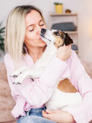 Resident holds her dog at Lofts at Allen Ridge in Abilene, Texas
