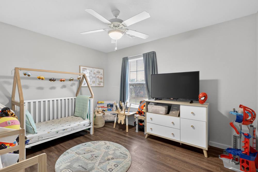 Charming children's bedroom with playful decor and cozy furnishings at Lakewood Crossing in Granbury, Texas.