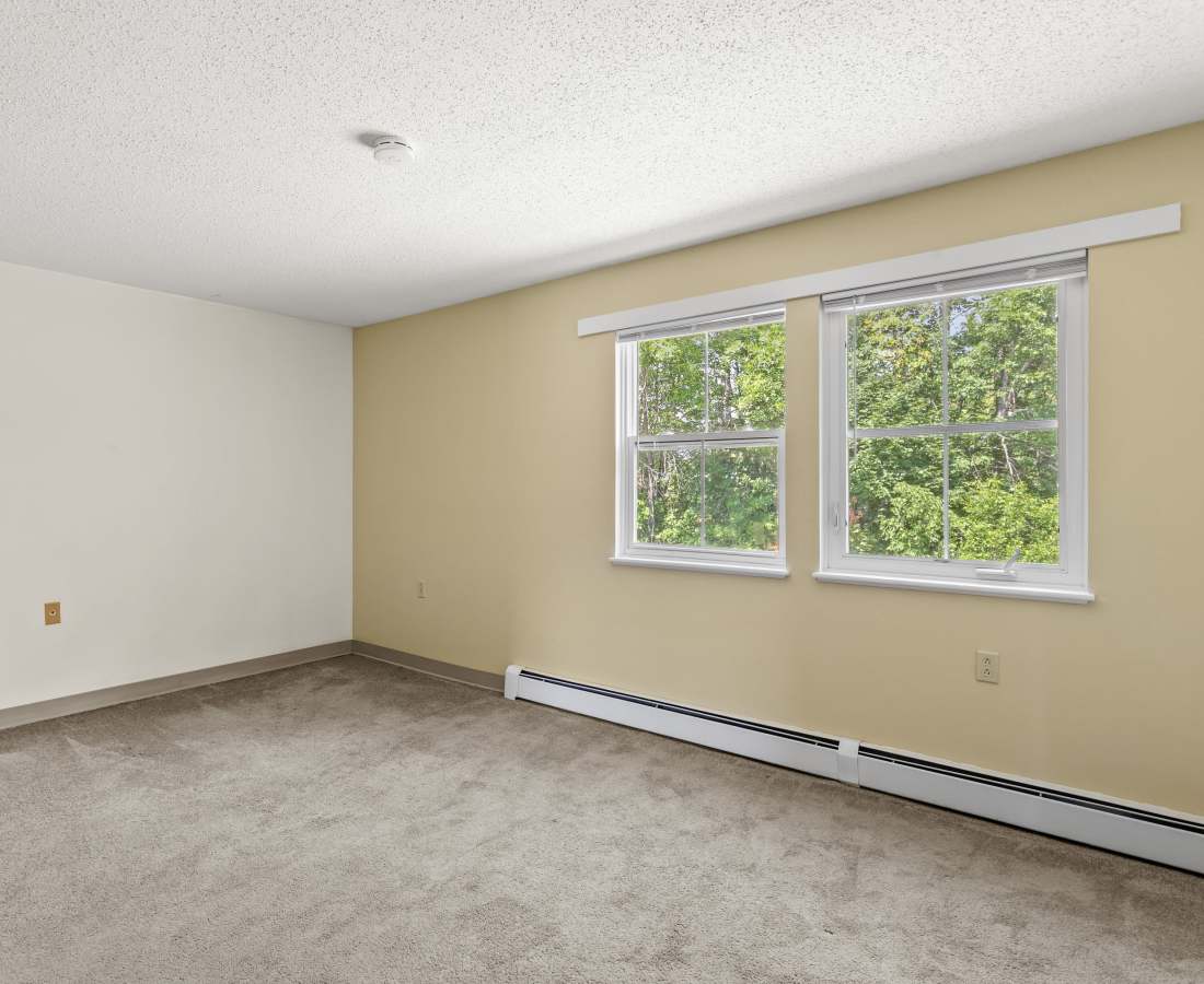 Unfurnished bright bedroom with windows at Glenridge Gardens in Augusta, Maine