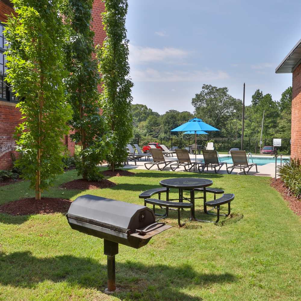 Outdoor grilling area at Lofts at Inman Mills in Inman, South Carolina