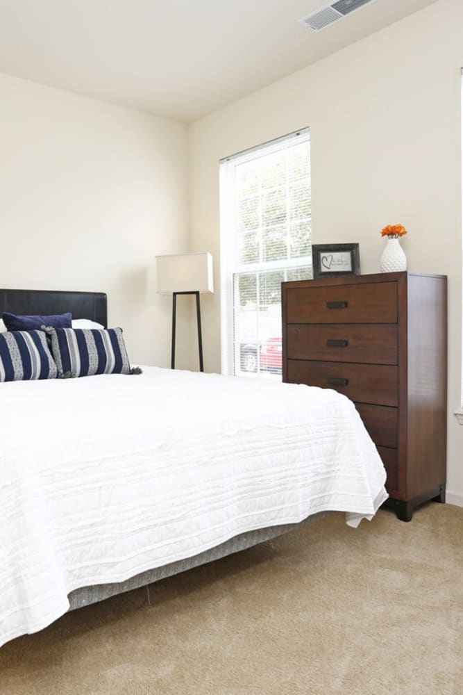 Bedroom with cozy furnishings at Watersedge in Champaign, Illinois