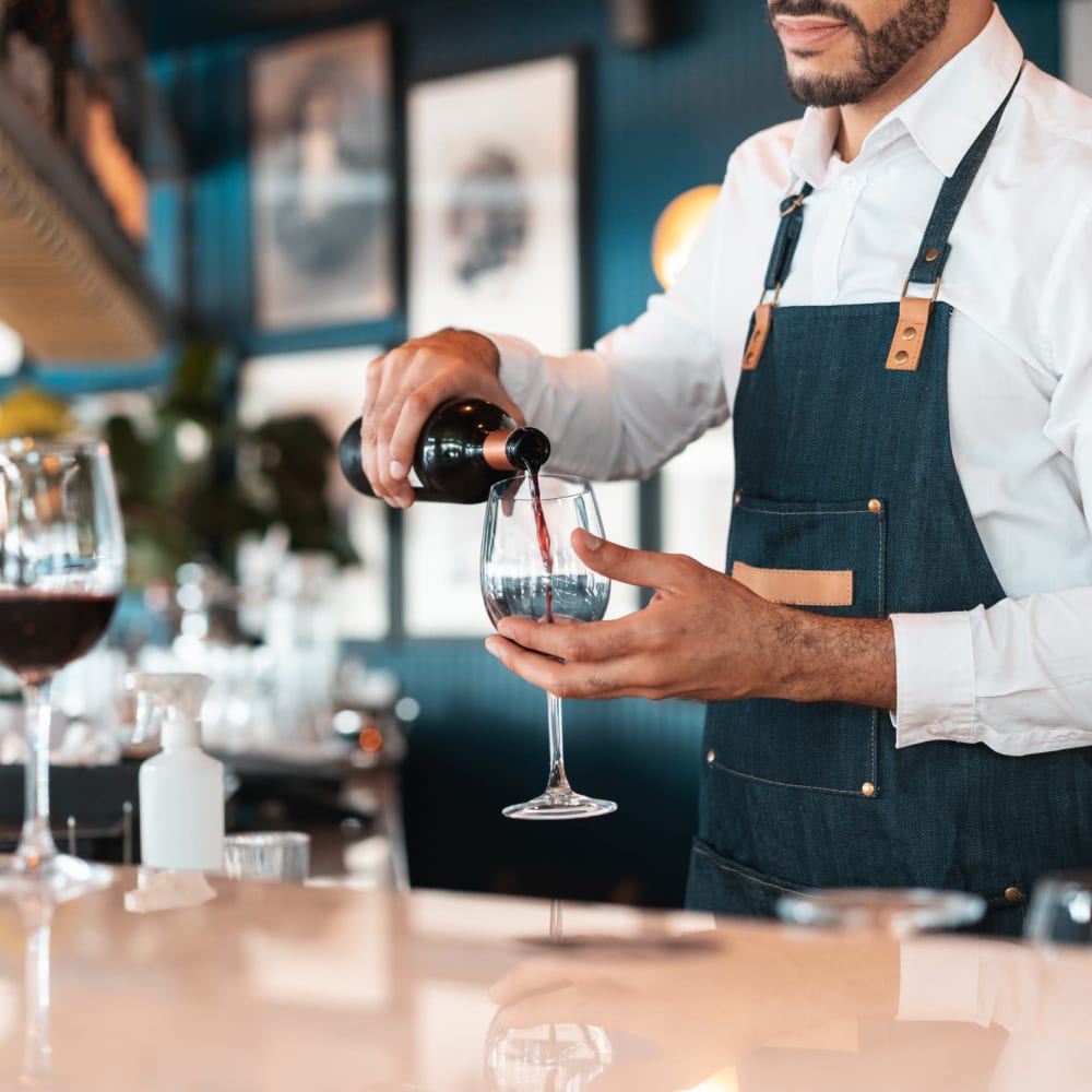 Bartender pouring a drink at 1510 Belleville in Richmond, Virginia