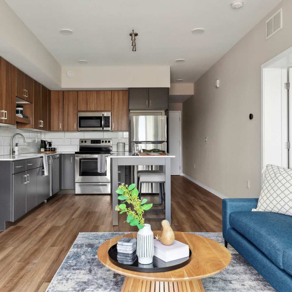 Living room with kitchen view at Oaks Pentagon Village in Edina, Minnesota
