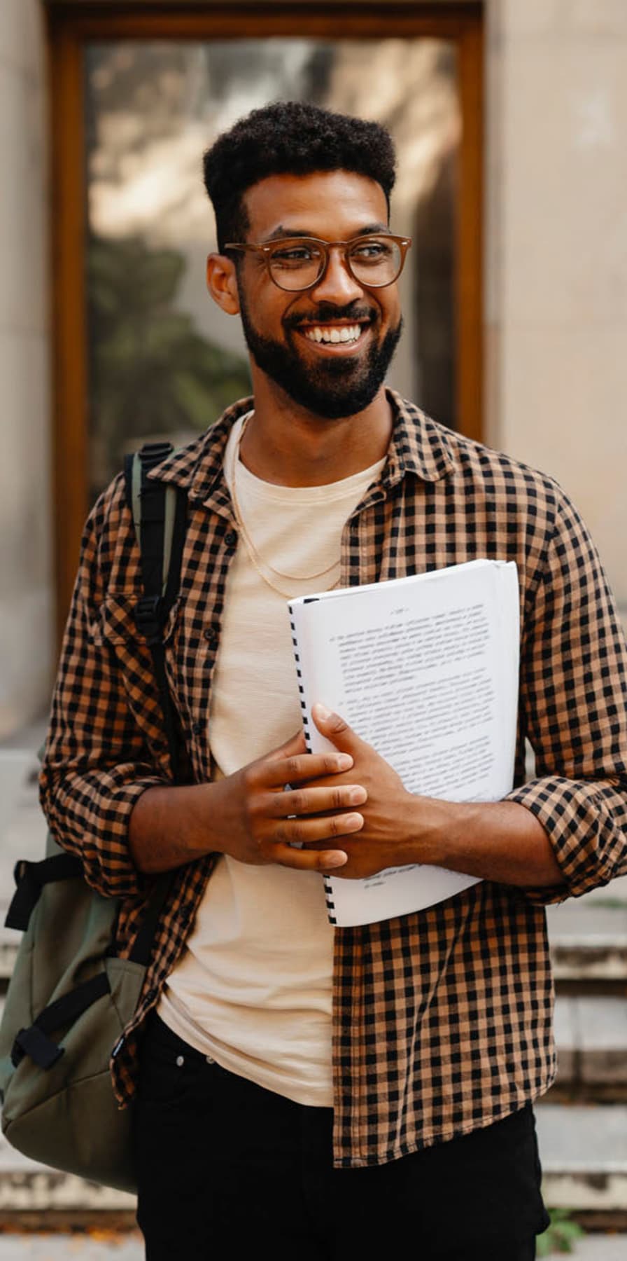 Student smiling near The Domain at Columbia in Columbia, Missouri