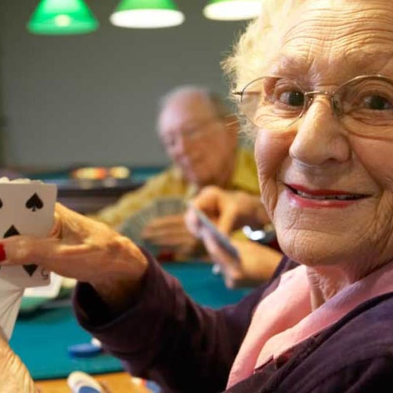 Seniors playing cards at Peninsula Reflections in Colma, California