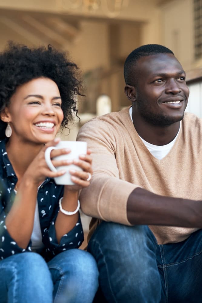 Residents enjoying coffee together outside their home at Sun Housing in Shuqualak, Mississippi