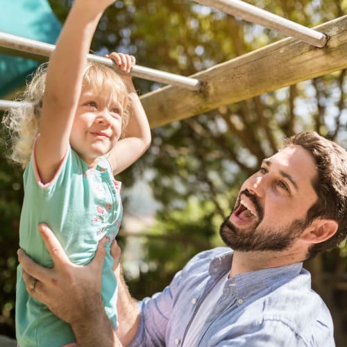 A father and child playing on the playground at Limestone Trail in Lebanon, Tennessee