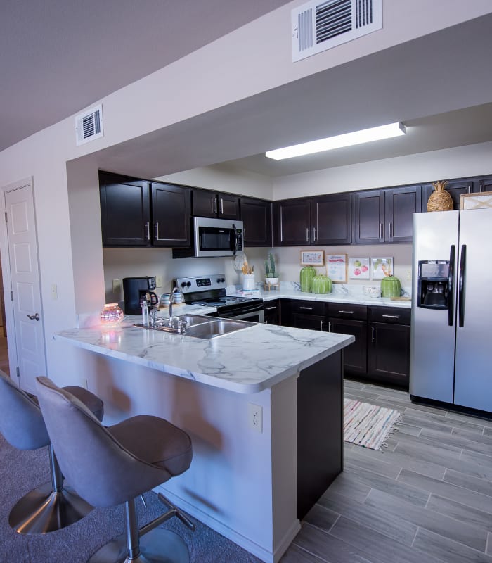 Kitchen with granite countertops at Icon at Hewitt in Hewitt, Texas