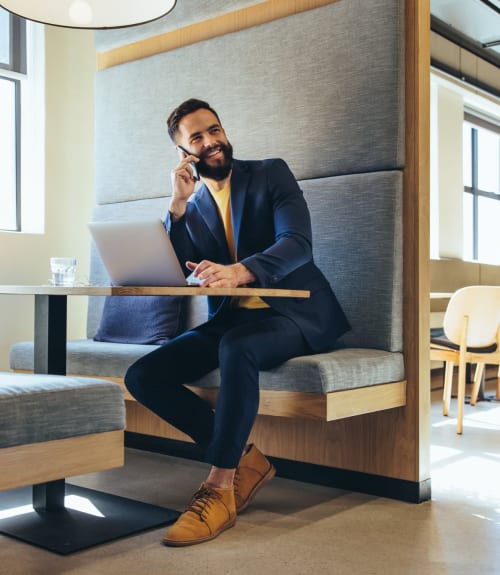 Resident sitting in the Business center at The Mallory in Raleigh, North Carolina