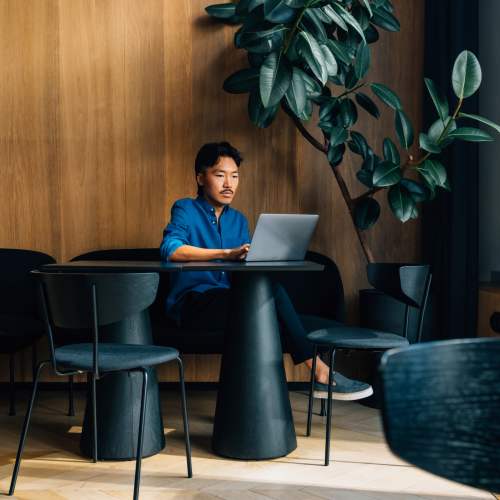 Resident working on a laptop at Oldham & Worth in Raleigh, North Carolina