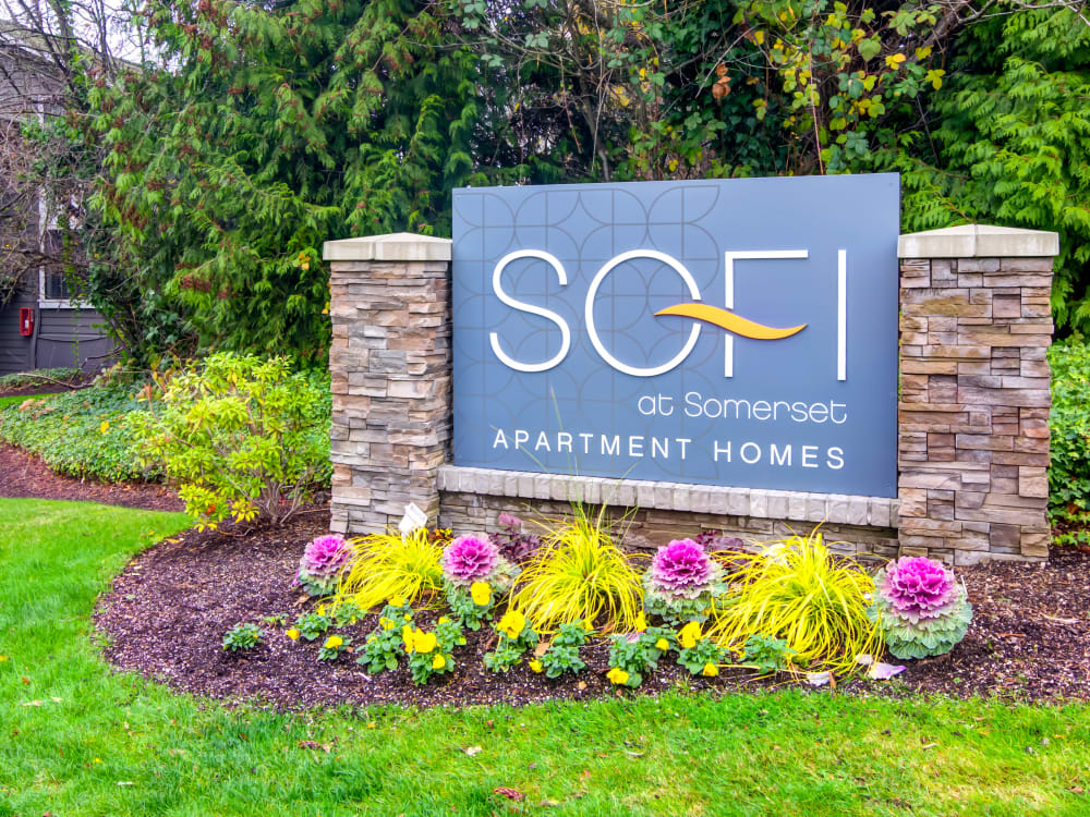 Our monument sign surrounded by flowers at Sofi at Somerset in Bellevue, Washington