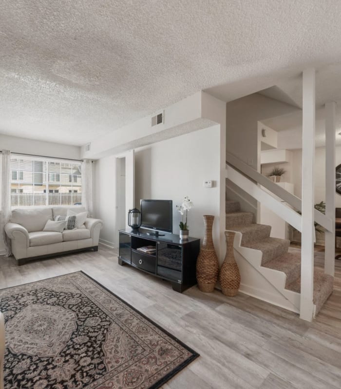 Spacious living room with large windows at Regency Point Apartments in Tulsa, Oklahoma