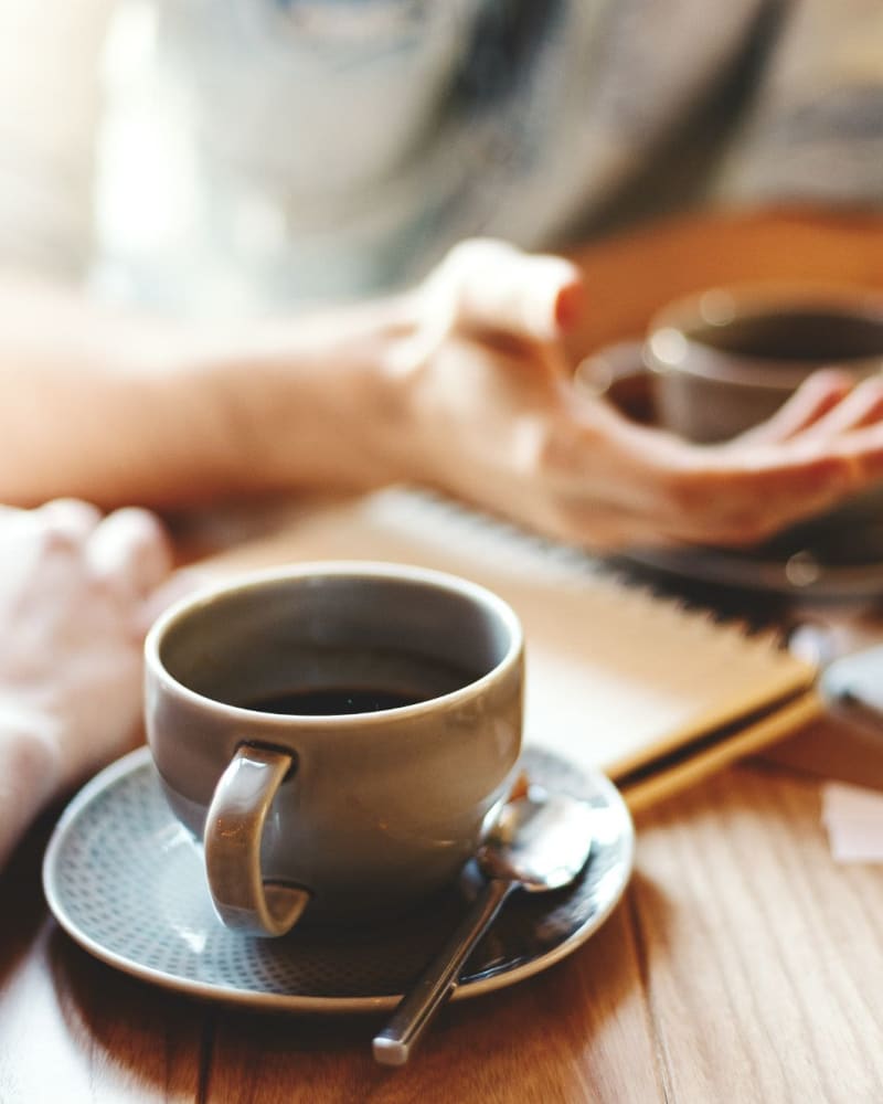 Residents enjoy coffee near Willow Creek, San Jose, California