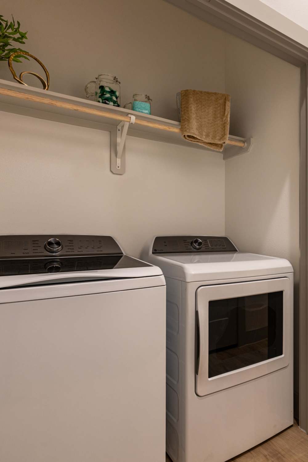 Full-size washer and dryer with storage included with every apartment at Winston Heights. 