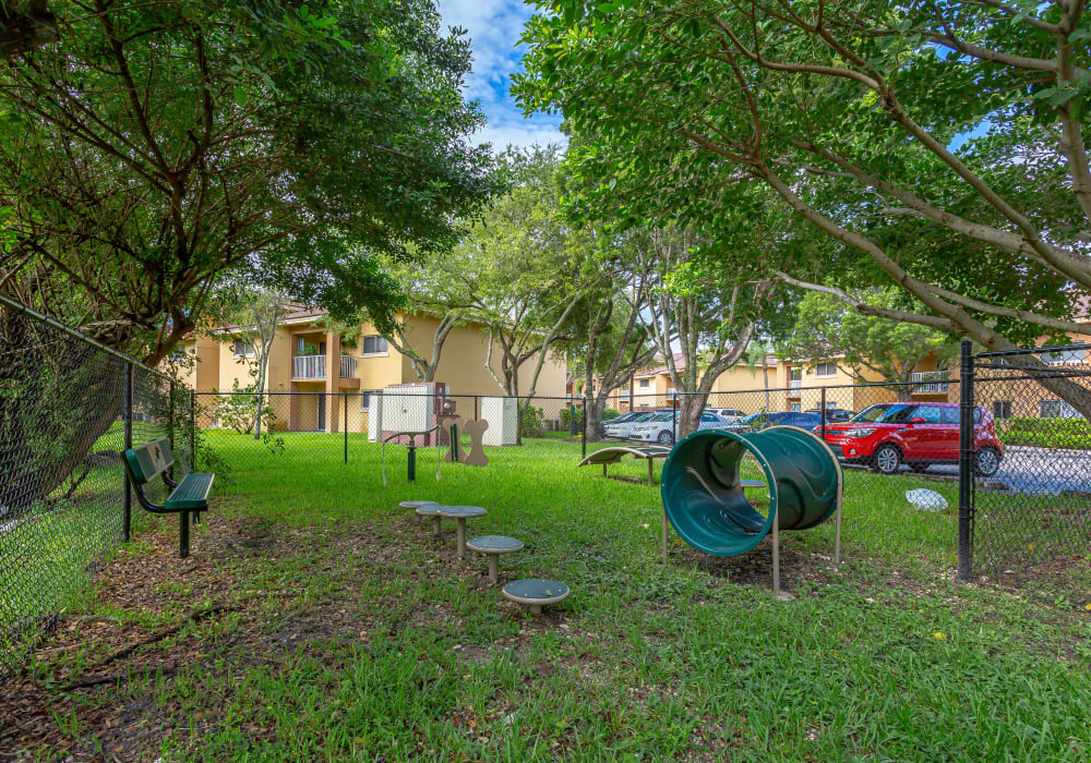 A fenced dog park at pet-friendly Fairway View Apartments in Hialeah