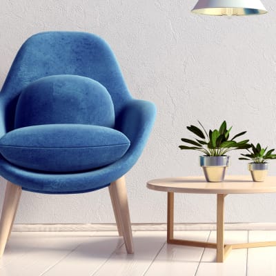 Art deco chair and thriving plants on an end table in a model home at Sofi at Cedar Mill in Portland, Oregon