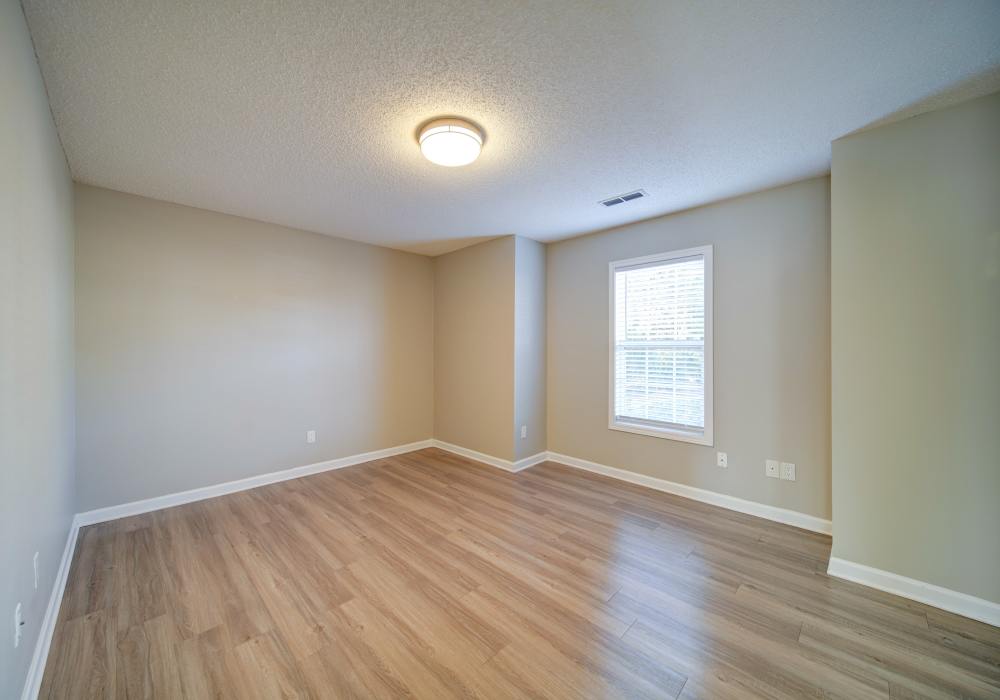 Wood style floored living area at Summers Run Apartments in Asheboro, North Carolina
